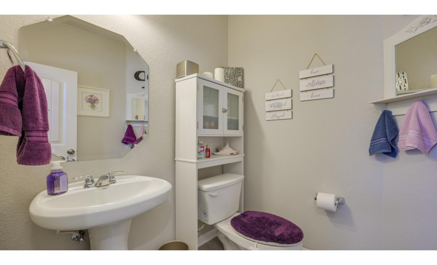 A powder room is well-appointed on the main level.