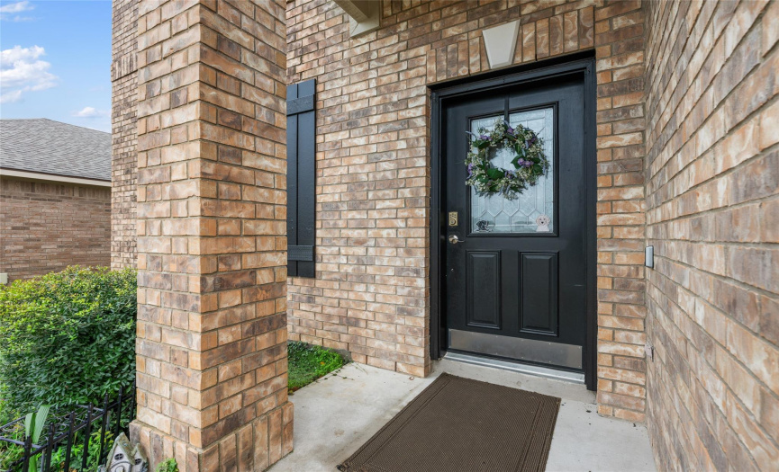 Greet your guests on this nice covered front porch. 