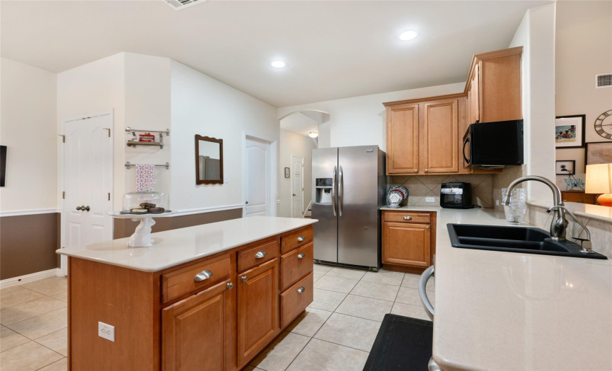The kitchen also features a nice, separate pantry for storage. The laundry room is located on this main level just off of the kitchen. 