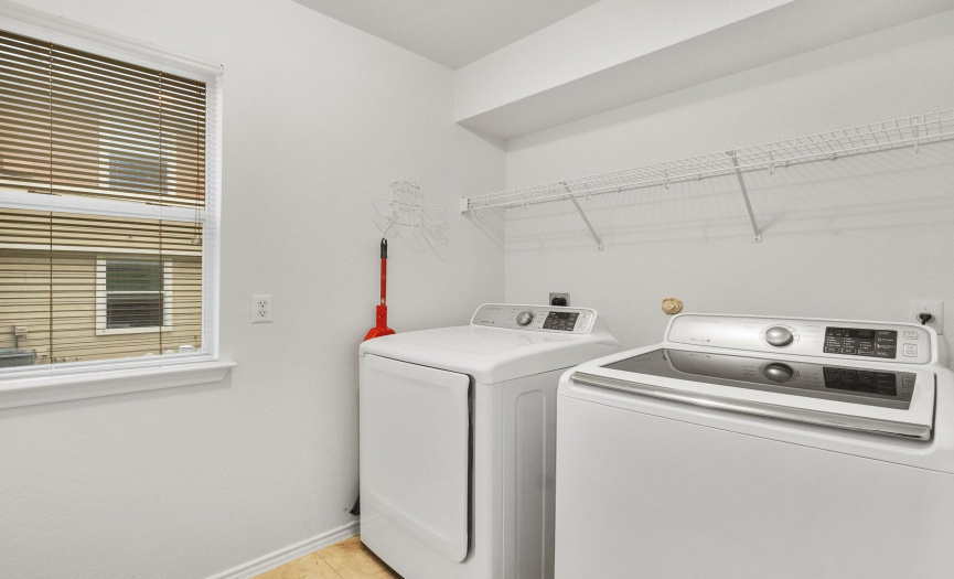 Laundry room with a built-in shelf for additional storage