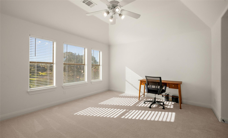The second floor consists solely of this spacious flex game room or bonus 5th bedroom plus a full bath. 