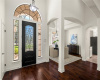 Step inside to discover a gran entry foyer which opens to the formal dining and living room through sweeping archways. 