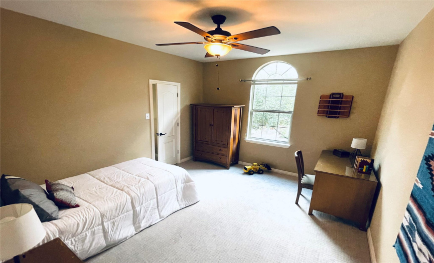 Spacious secondary bedroom with new carpet and walkin closet.