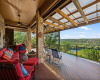 Multiple seating areas on the oversized, extensive patio with incredible lake and hill country views!