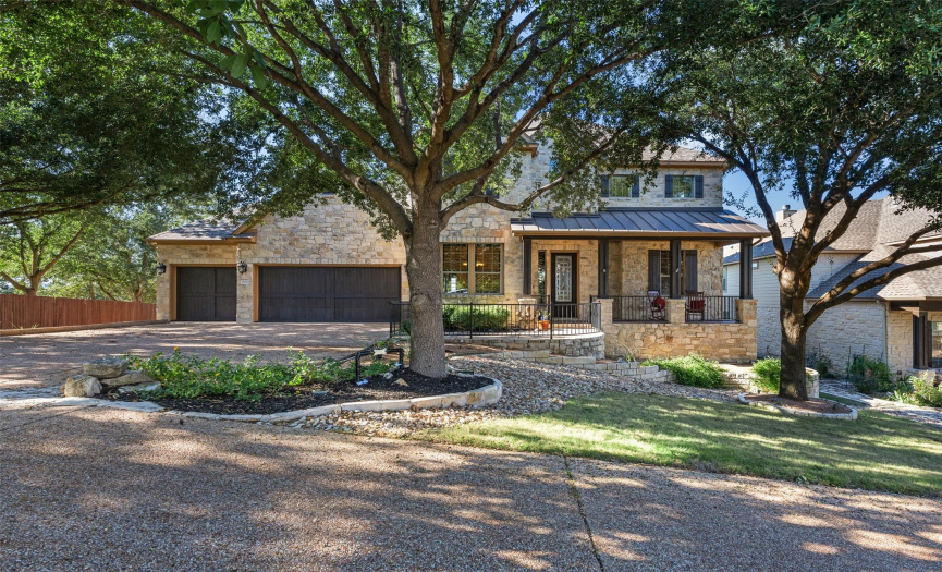 Lovely stone home nestled by mature trees on private drive extension off of the end of a cul-de-sac! Extended driveway, 4-car garage (3 car garage with 4th car tandem). Front porch entry accented by wrought iron railing. Feels like home!