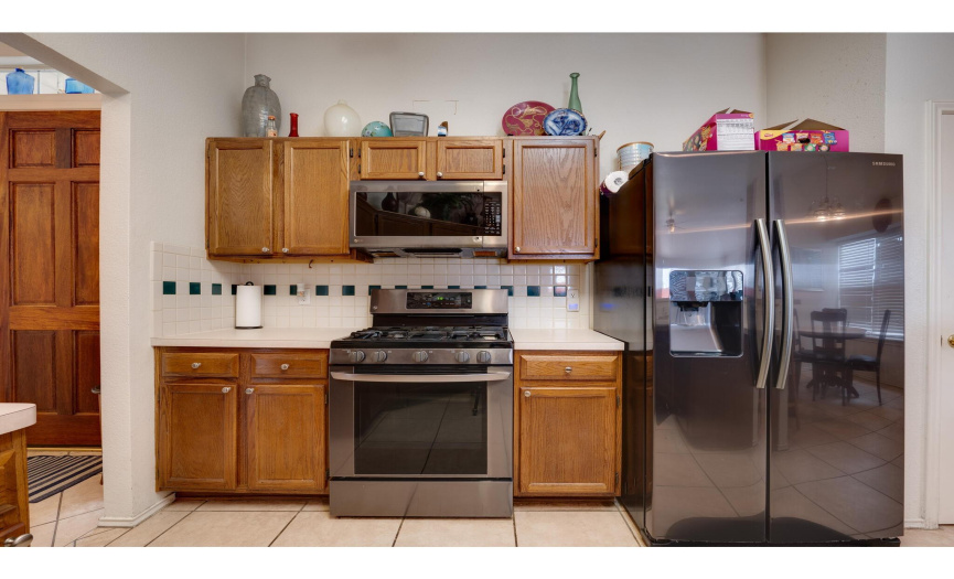 Featuring sleek stainless steel appliances (all convey with sale). 