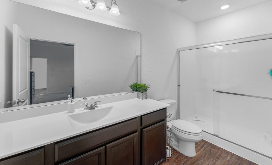 Enjoy the serenity of this space, complete with an ensuite bath featuring an oversized single vanity and a step-in showe