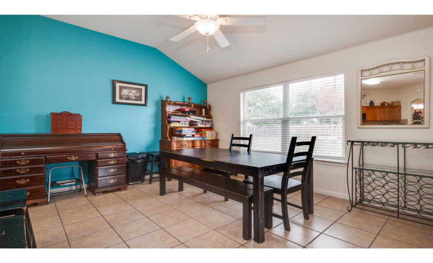 The dining area alongside the kitchen is impressively spacious and provides plenty of space for a large dining table, hutches, desks, and more. 