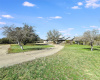 Circle driveway to this 14.7 acre ranch home