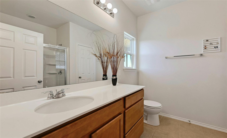 Primary Bathroom- great natural lighting with a window!