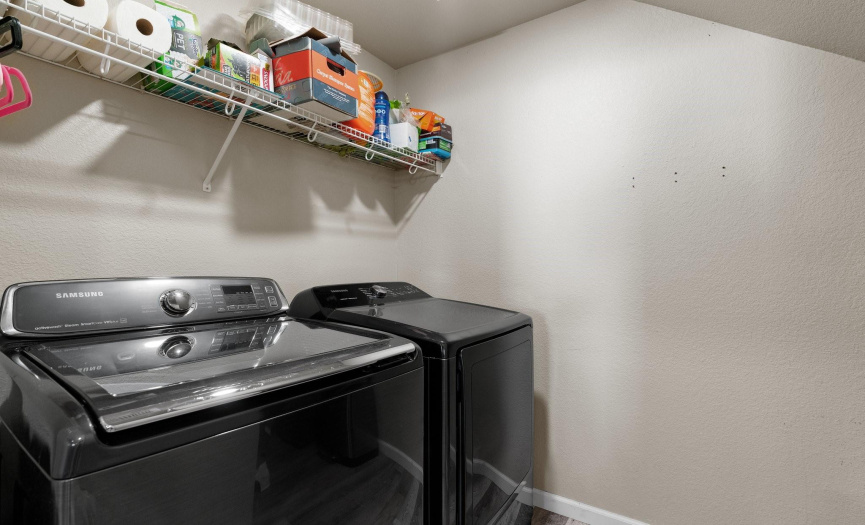 The laundry room is a combined laundry/pantry just off the kitchen.