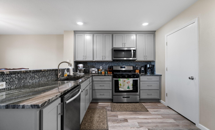 The remodeled chef's kitchen is a stunning centerpiece in the home.