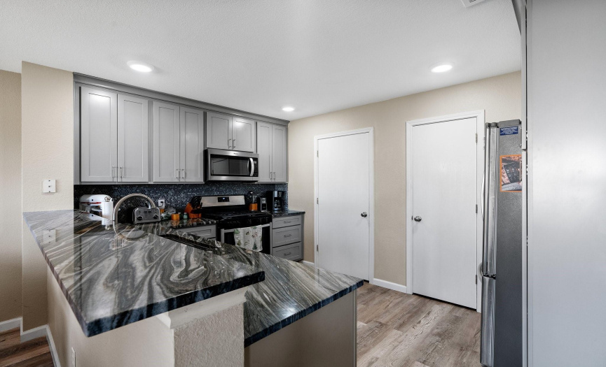 Recessed lighting reflects in the kitchen and further enhances the luxurious ambiance.
