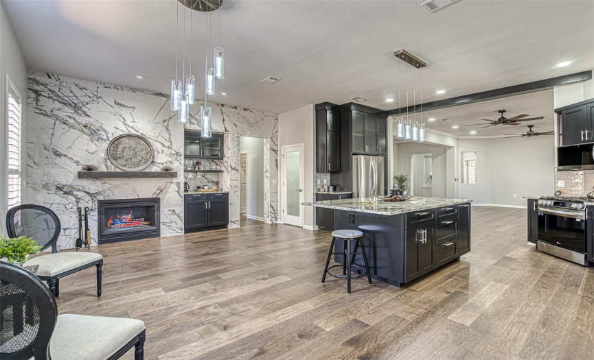 Kitchen and Family Room that warms guests while you cook them a fabulous dinner in your gourmet kitchen.