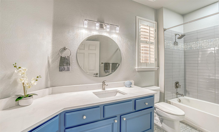 Notice all the unusual touches that have been added to make this a bathroom almost as lovely as the primary bath.