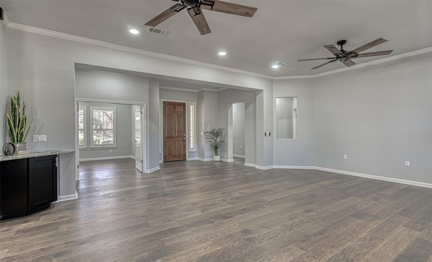 Rich wood flooring throughout except new carpeting in bedrooms and tile in the baths.