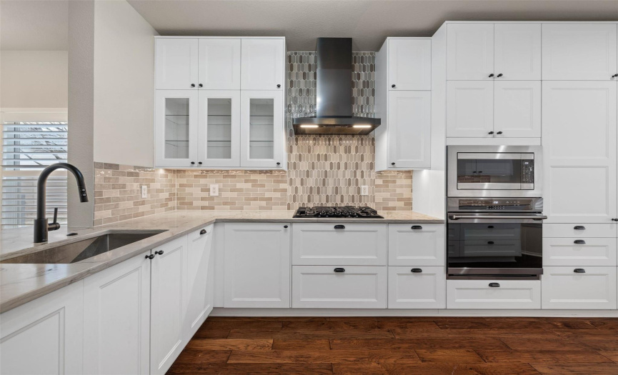 Tons of storage in this amazing and new kitchen. Easy to cook with the 5-burner cooktop.