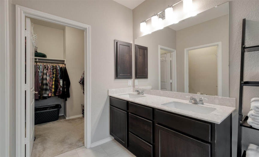 A large dual vanity provides you with ample storage.
