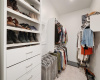 The larger of the two primary closets features built in drawers and shoe storage.