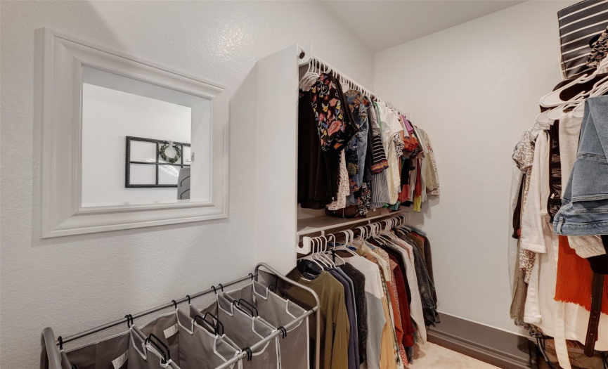 A handy pass through door connects the primary closet to the laundry room.