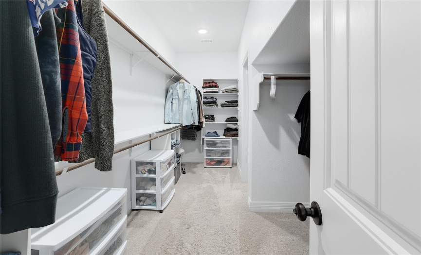 The walk-in closet provides ample space to organize your belongings, ensuring both convenience and accessibility.