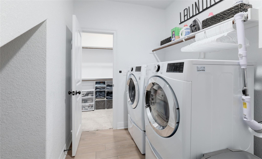 Enjoy two huge walk-in closets in the main suite space - one that adjoins the laundry room for added convenience.