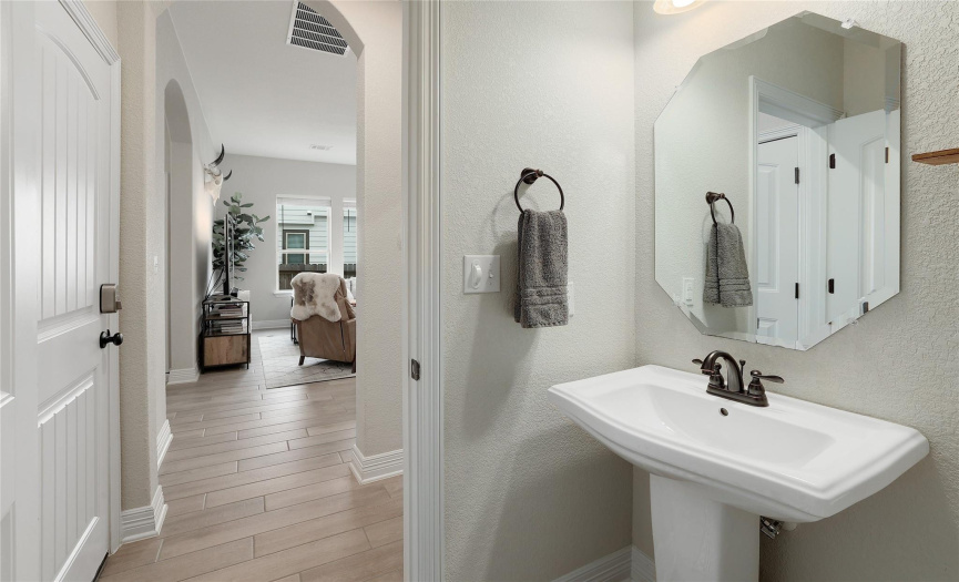 The half bath / powder room downstairs is convenient to the office and for downstairs guests.