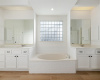 Double vanities with drawer storage in the primary bath