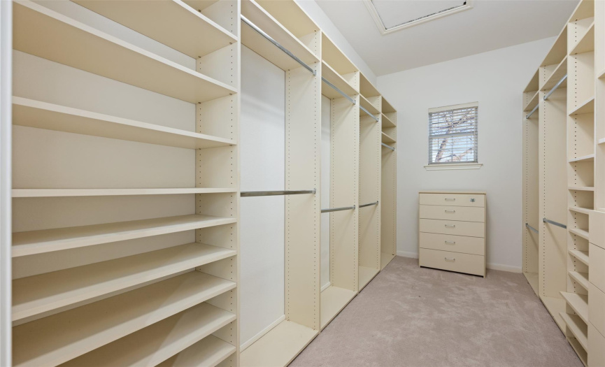 This closet is fully furnished with shelves and drawers.
