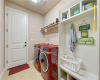 Spacious laundry and mudroom is centrally accessible and comes off the garage