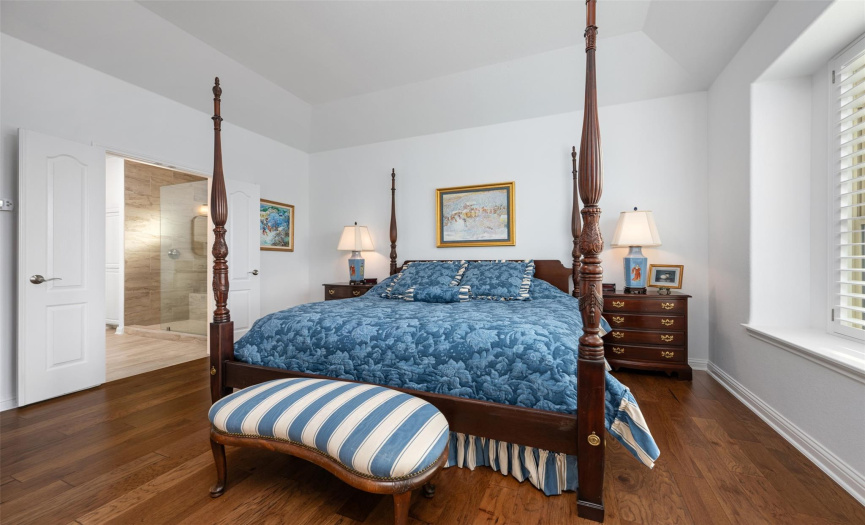 King-sized bed and in-suite bath with large walk-in closet