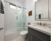 4th bedroom has it's own bath. New mirror, quartz counters, toilet, fixtures, and shower door
