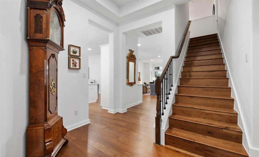 Staircase to large office/game room upstairs. This home lives like a one story