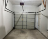 One car garage with automatic garage door opener.