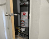 The hot water heater is also located in the garage.