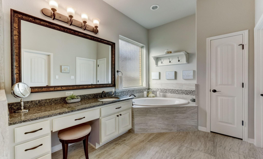 Separate vanities and large mirrors allow you to prepare for your day with ease