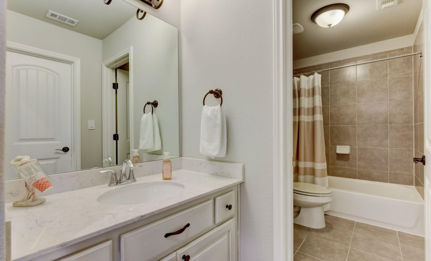 Two of the rooms share a bathroom but have their own private vanity space
