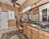 Redesigned bath with walk-in shower, granite counters and designer lighting and mirrors