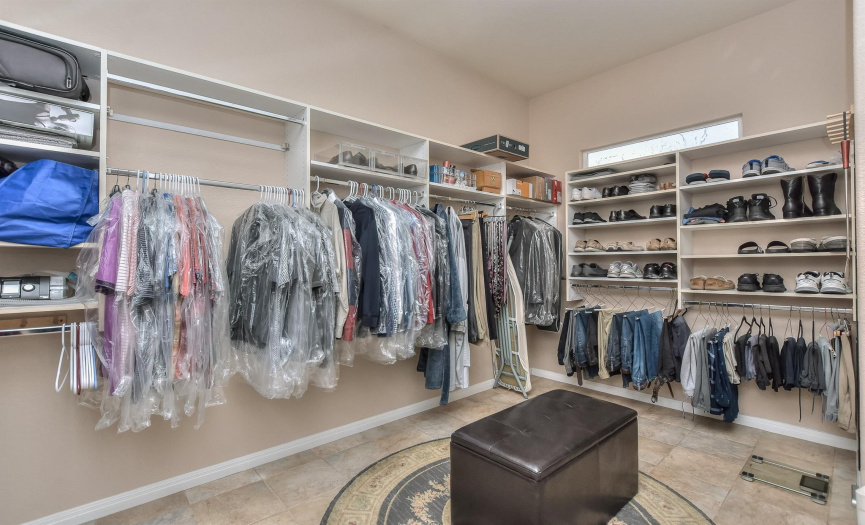 Extra large primary closet, 13 X 13 with additional shelving.