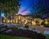 Estate comes to life at twilight with its expansive landscape lighting