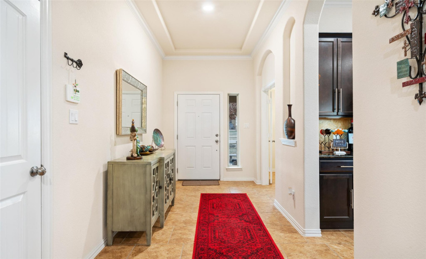 Warm and inviting entry way with high ceilings.