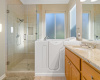 Walk-in, spa-like tub for relaxation/