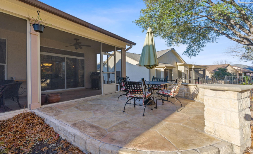 Extended flagstone patio is relaxing and beautiful by the greenbelt and fountain. 
