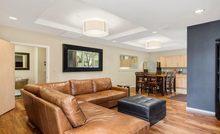 Owner's lounge features comfortable seating, flatscreen TV, library and kitchen features.
