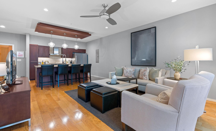Gleaming pecan floors and the perfect gray wall paint give a warm, modern feel.