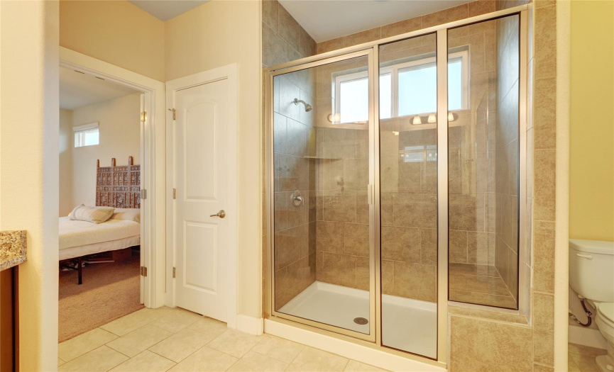 Another angle of the spacious main bathroom off the main bedroom. You'll love the large walk in shower with shower stool!