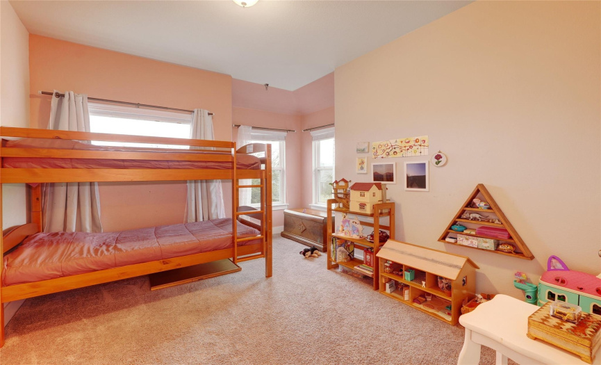 The home features 3 bright and airy bedrooms, offering plenty of comfortable space for various needs. The wonderful window placement and nook in this room would be perfect for a reading area!