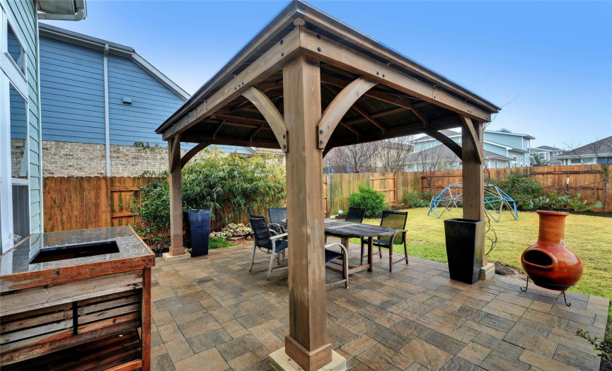 This outdoor living space has ample room for relaxation, dining, and all-around fun!
