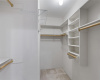 Large walk-in closet with built-in shelves!