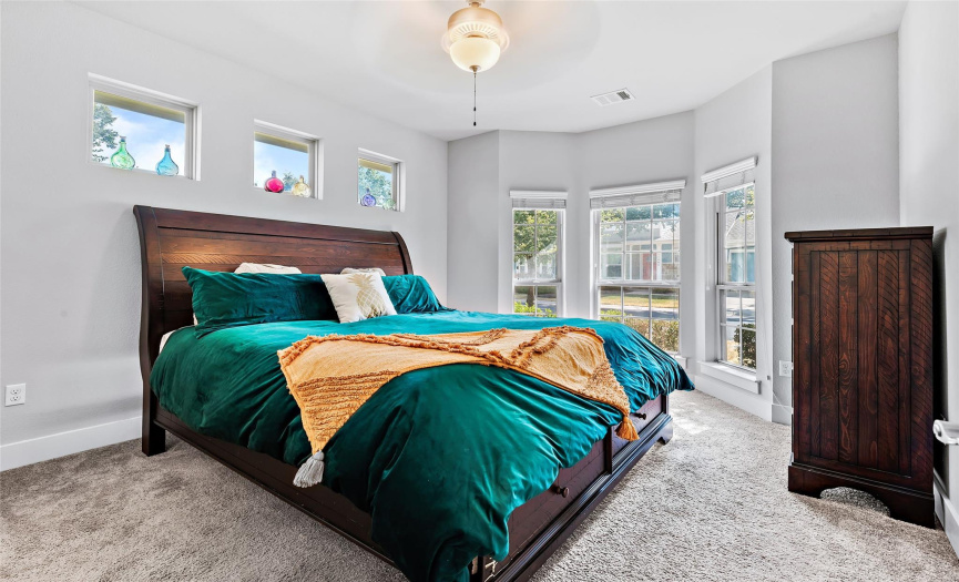 The primary bedroom is conveniently located on the 1st floor & has a bay window seating area